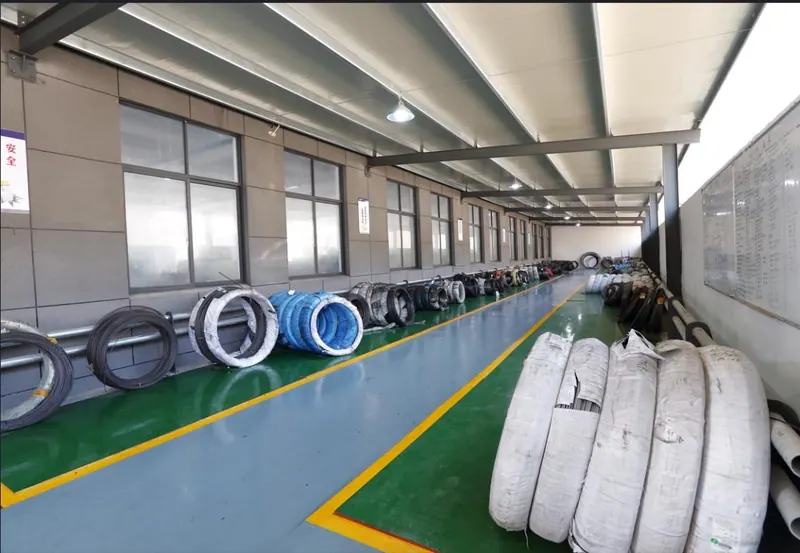Raw material store with steel wire coils and bar stock