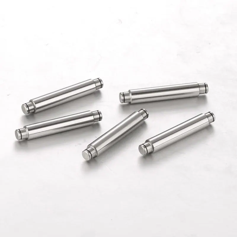 Short precision pins with grooves on a light background